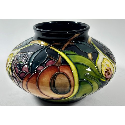 13 - A Moorcroft Queen's Choice squat vase, decorated with grapes, figs and peaches with original box 12c... 