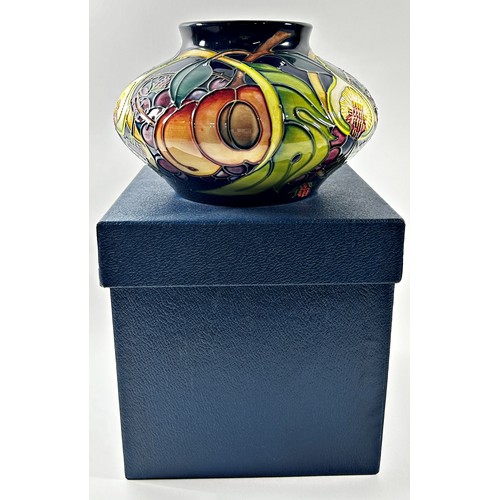 13 - A Moorcroft Queen's Choice squat vase, decorated with grapes, figs and peaches with original box 12c... 