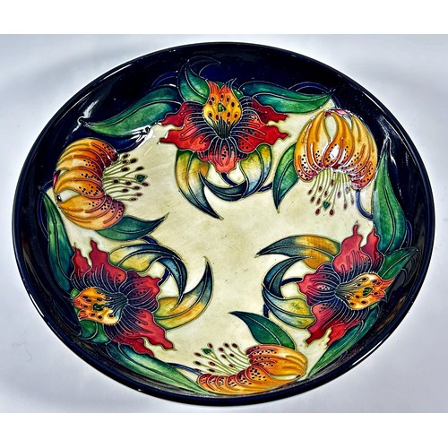 17 - A Moorcroft Anna Lily pattern bowl, in original box, 26cm diameter