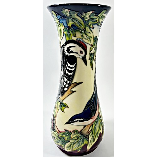 18 - A Moorcroft trumpet shaped Inglewood pattern vase showing woodpecker, tree-creeper etc, 31cm high, i... 