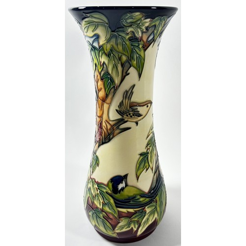 18 - A Moorcroft trumpet shaped Inglewood pattern vase showing woodpecker, tree-creeper etc, 31cm high, i... 