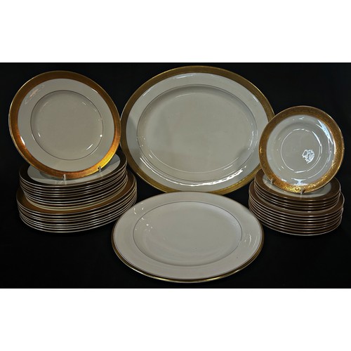 27 - A Royal Worcester Durham pattern dinner service comprising graduated plates, tureens, soup bowls, ve... 