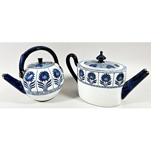 32 - An aesthetic period Marigold pattern blue and white globular teapot and further example in oval form... 