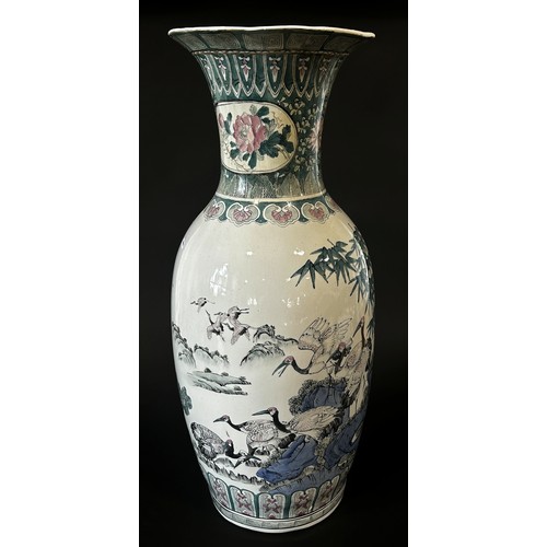 72 - A floor-standing decorative Chinese vase, 78cm high, decorated with cranes and landscape