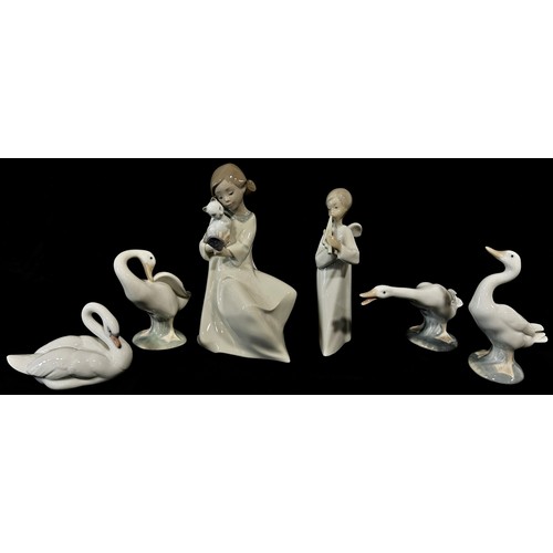 84 - Eight Lladro figures comprising four bears, three geese and a swan together with two Nao figures