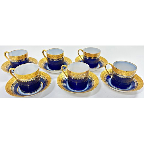 85 - A Beswick figure of a fox, and six Limoges coffee cans and saucers in a blue and gilt colourway