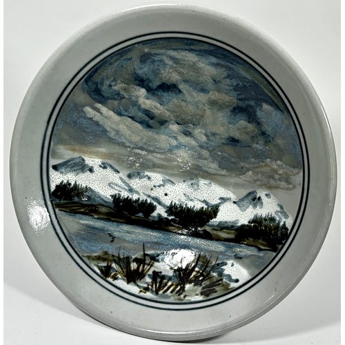 95 - A Highland stoneware studio dish with hand-painted landscape detail, 30cm diameter