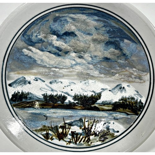 95 - A Highland stoneware studio dish with hand-painted landscape detail, 30cm diameter