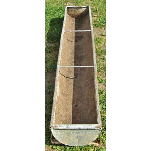 1042 - A weathered rectangular galvanised feeding trough with two simple rung divisions, later drilled and ... 