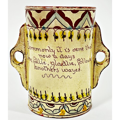 103 - Barnstaple ware - motto tankard with script and geometric detail and lug handles