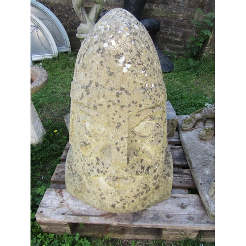 1049 - A large reconstituted stone head of a Norman soldier with helmet, 80cm high (af)