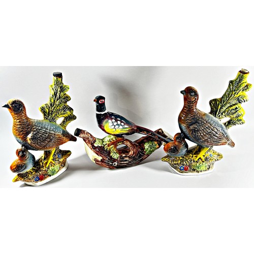 107 - A collection of ten ceramic liqueur flasks by Garnier in the form of mainly game birds