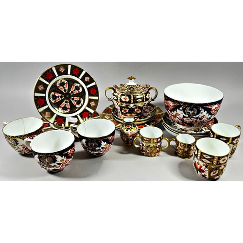 38 - A Collection of Crown Derby Imari ware including graduated plates, sugar basin and cover, cups and s... 