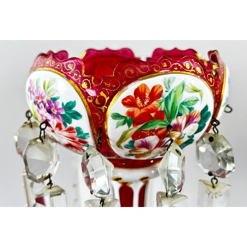 31 - A 19th century Dresden porcelain urn raised on three shaped supports with hand-painted panels showin... 