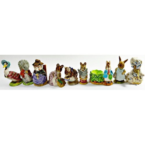 127 - A collection of Royal Albert, Beswick and other Beatrix Potter figures, together with a Wedgewood Pe... 