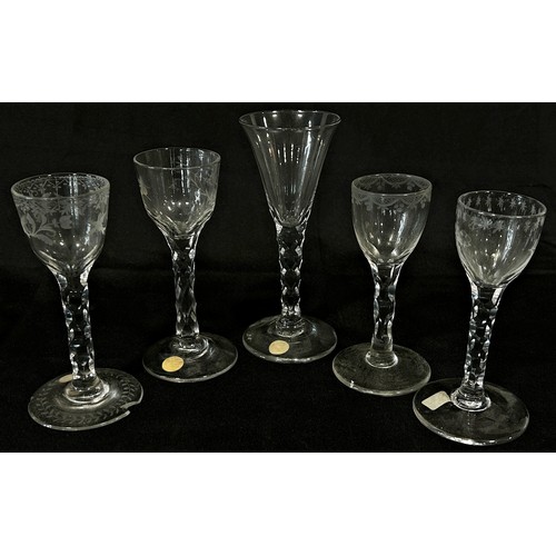 161 - Four five sided faceted stemmed wine glasses, circa late 18th and 19th century, together with a sing... 