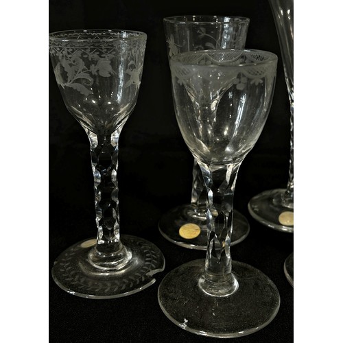 161 - Four five sided faceted stemmed wine glasses, circa late 18th and 19th century, together with a sing... 