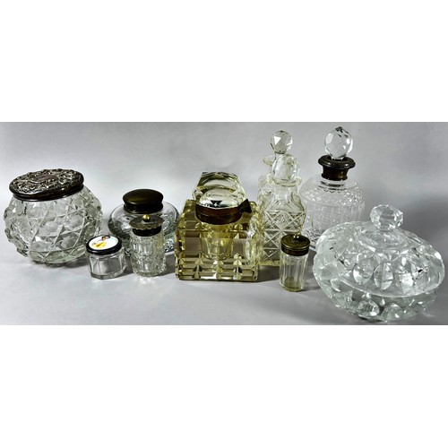 166 - A group nine of cut-glass bottles some with silver tops or collars and a porcelain pill box with hal... 