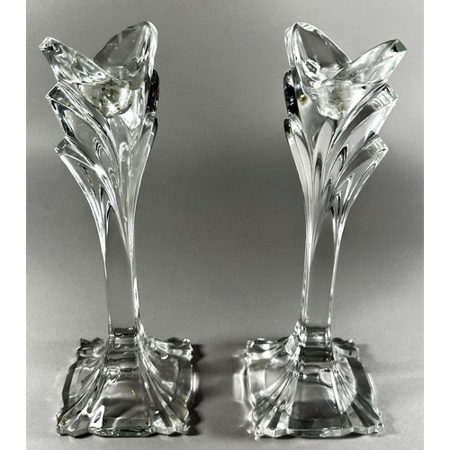 176 - A pair of Baccarat style glass flower inspired candlesticks, 24.5cm high.