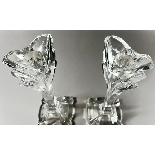 176 - A pair of Baccarat style glass flower inspired candlesticks, 24.5cm high.