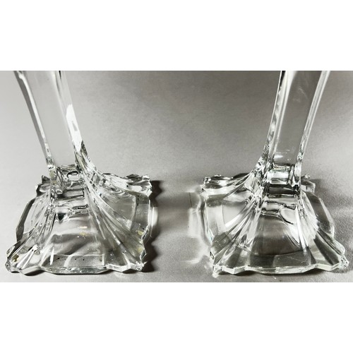 176 - A pair of Baccarat style glass flower inspired candlesticks, 24.5cm high.