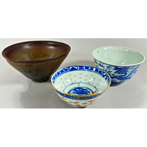 52 - A Japanese glazed terracotta bowl of flared form and two 19th century Chinese porcelain bowls with d... 