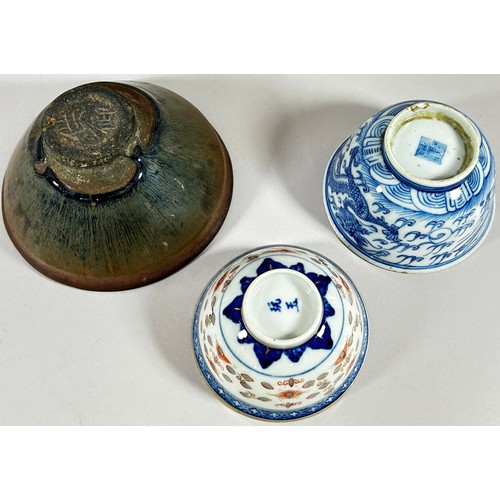 52 - A Japanese glazed terracotta bowl of flared form and two 19th century Chinese porcelain bowls with d... 