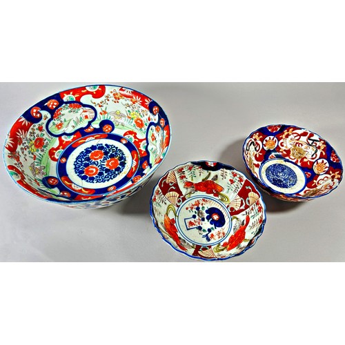 50 - Collection of Imari porcelain - four Imari dishes with fluted borders and three bowls, all with typi... 