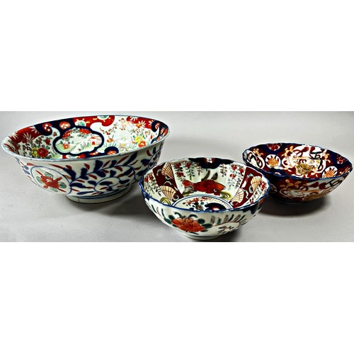 50 - Collection of Imari porcelain - four Imari dishes with fluted borders and three bowls, all with typi... 