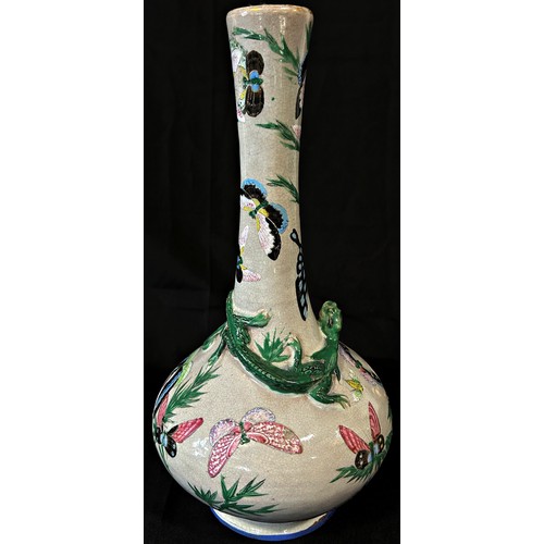 66 - A 19th century crackle glazed vase with drawn neck and moulded lizard detail with painted butterfly ... 