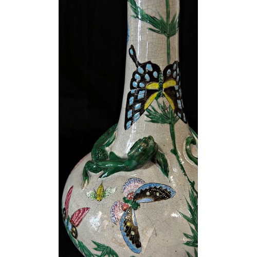 66 - A 19th century crackle glazed vase with drawn neck and moulded lizard detail with painted butterfly ... 