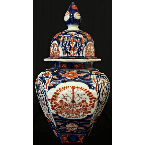 65 - 19th century Imari lidded vase of hexagonal form with typical detail