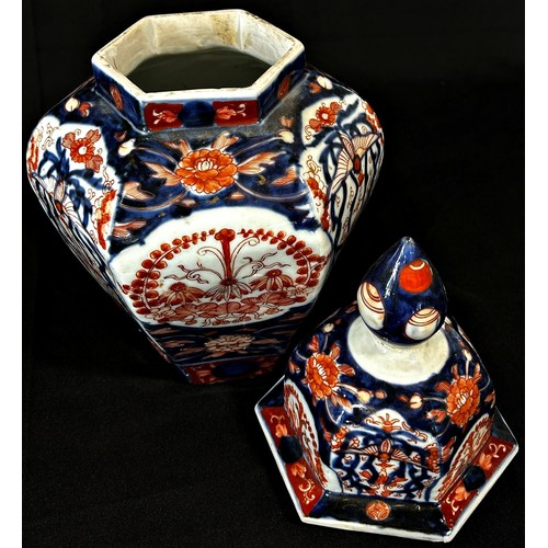 65 - 19th century Imari lidded vase of hexagonal form with typical detail