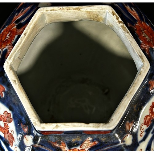 65 - 19th century Imari lidded vase of hexagonal form with typical detail