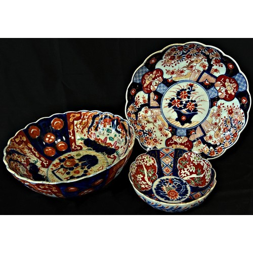 67 - Two Imari bowls with fluted borders and a further Imari dish, 29cm diameter and smaller