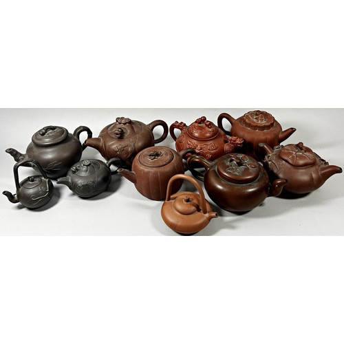 70 - A large collection of Chinese Yixing terracotta type teapots