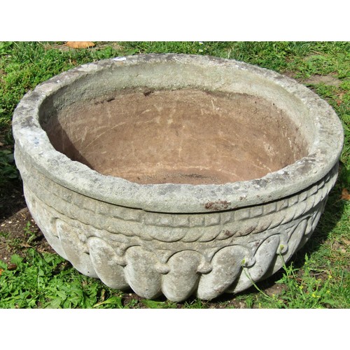 1063 - A weathered cast composition stone squat circular planter with lobbed bowl 25 cm high x 55 cm diamet... 