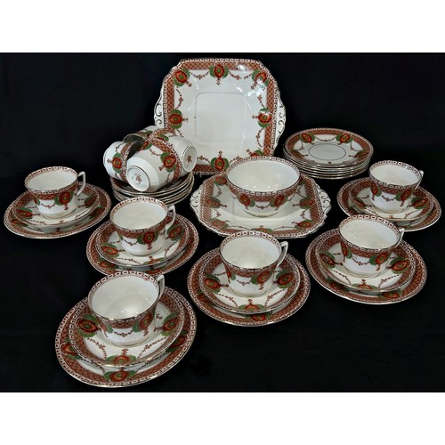 136 - A ceramic tea service for 12 comprising cups, saucers and plates with printed and hand-painted detai... 