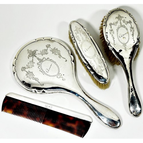 245 - Silver dressing table ware including a hand mirror, hair and clothes brush, three glass jars, comb, ... 