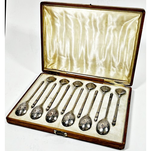 246 - A cased set of twelve Russian silver teaspoons stamped Moscow 84 initialled M A with flowers engrave... 