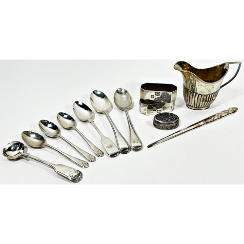 260 - A mixed selection of silver including a cream jug, letter opener, pill box, teaspoons and a pair of ... 