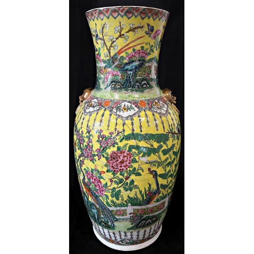 63 - A Chinese 19th century Famille rose vase with a decorative flower and bird design on a yellow ground... 