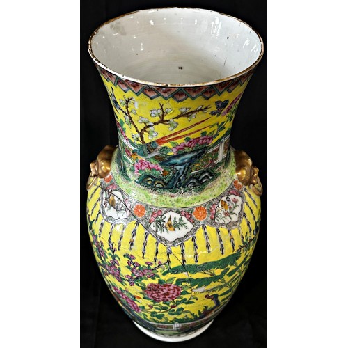 63 - A Chinese 19th century Famille rose vase with a decorative flower and bird design on a yellow ground... 