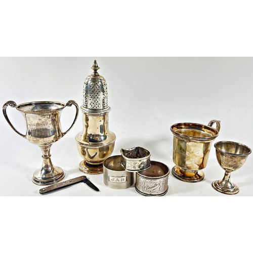 265 - A mixed selection of silverware including a small Christening tankard, a sugar castor, a small troph... 