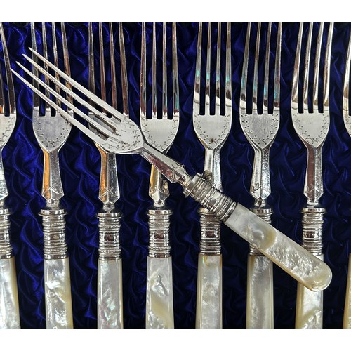 201 - A Victorian canteen of cutlery, twelve Mother of Pearl knives and forks with decorative floral engra... 