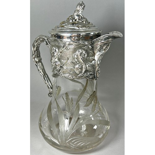 208 - A good quality early 20th century silver plated claret jug with engraved flowers to collar and spout... 