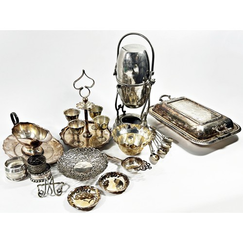 191 - A quantity of silver plated tableware including an egg cup stand, sauce boat, bowls, a tea urn with ... 