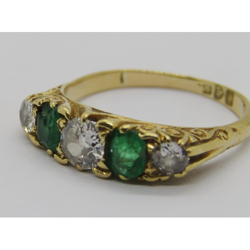 316 - Edwardian 18ct five stone emerald and diamond ring, centre diamond 0.40ct approx, outer diamonds 0.1... 