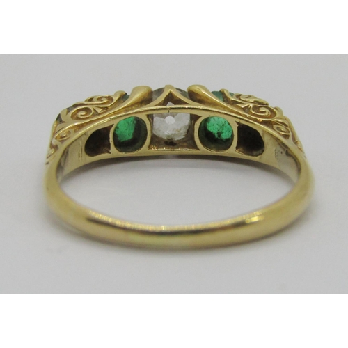 316 - Edwardian 18ct five stone emerald and diamond ring, centre diamond 0.40ct approx, outer diamonds 0.1... 