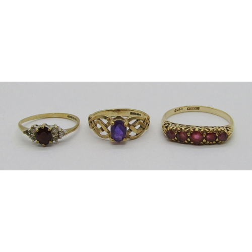 329 - Three vintage 9ct gem set dress rings comprising a five stone ruby example, size Q, a Celtic style a... 